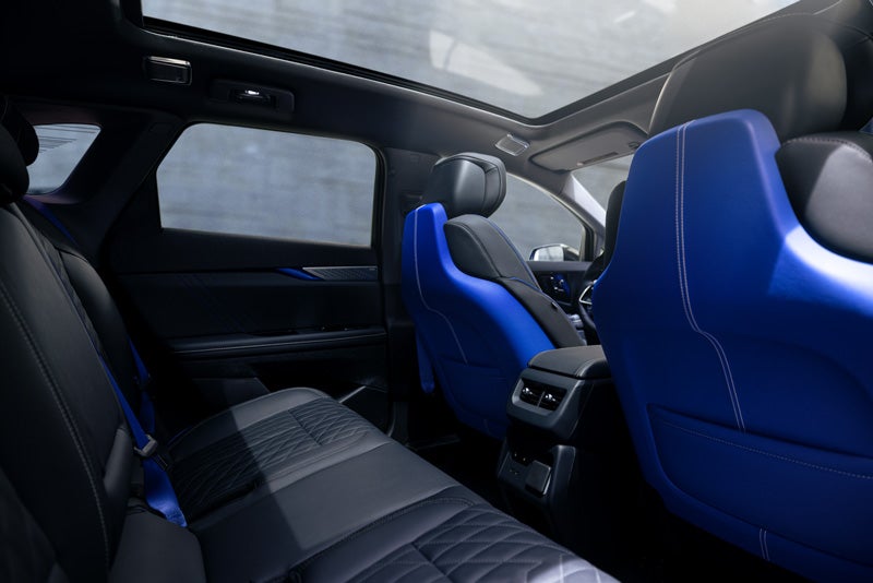 Back Seat View of the 2026 OPTIQ-V Blue Front Seats, Sun Roof, and Interior | Miller Brothers Cadillac in Ellicott City MD